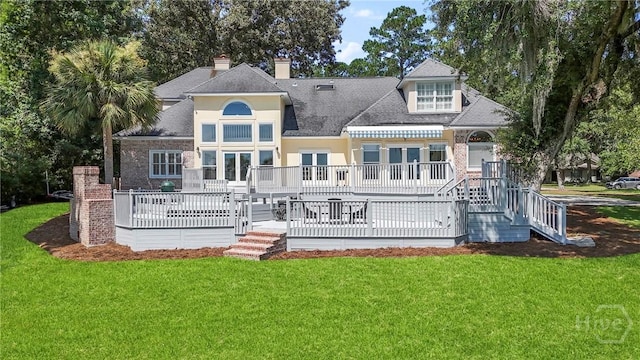 271 Davis Rd, Richmond Hill, GA 31324 - rear view of property featuring french doors, a yard, a deck, a chimney, and a shingled roof