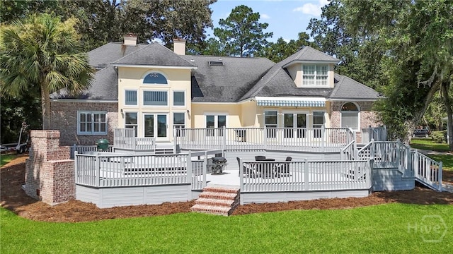 271 Davis Rd, Richmond Hill, GA 31324 - rear view of house featuring a wooden deck, stairway, and a lawn