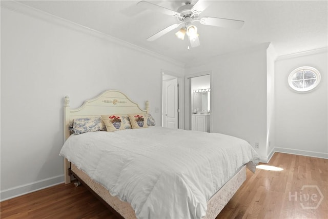 271 Davis Rd, Richmond Hill, GA 31324 - bedroom featuring ornamental molding, wood finished floors, a ceiling fan, and ensuite bathroom