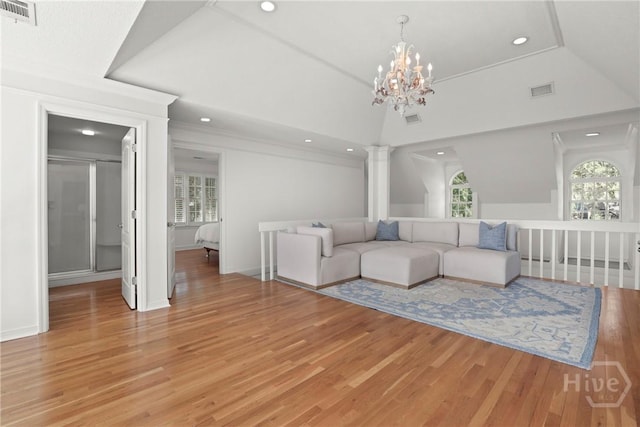 271 Davis Rd, Richmond Hill, GA 31324 - living area featuring recessed lighting, light wood-style flooring, decorative columns, a chandelier, and vaulted ceiling