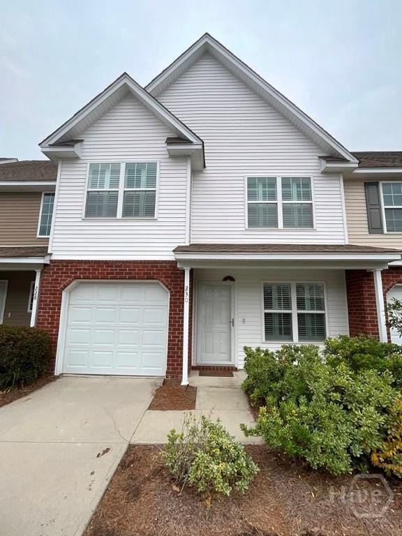 230 Opus Ct, Pooler, GA 31322 - traditional-style house featuring concrete driveway, a garage, and brick siding