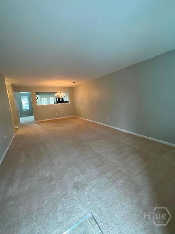 230 Opus Ct, Pooler, GA 31322 - unfurnished room featuring a chandelier and carpet flooring