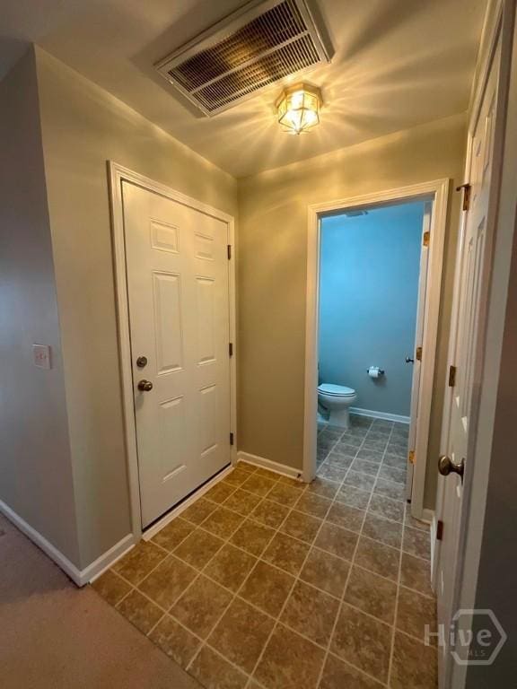 230 Opus Ct, Pooler, GA 31322 - entrance foyer with baseboards and dark tile patterned flooring