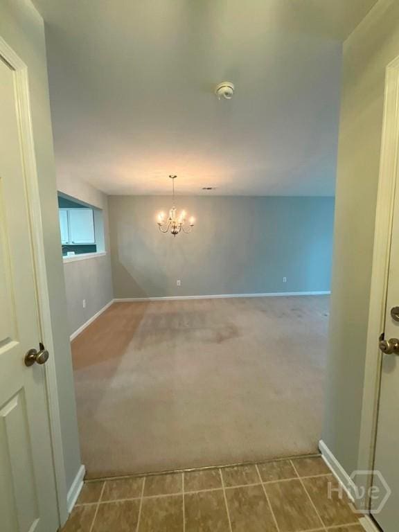 230 Opus Ct, Pooler, GA 31322 - tiled spare room with carpet, a smoke detector, and a chandelier
