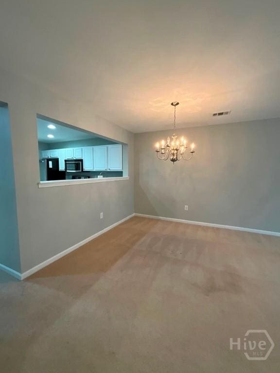 230 Opus Ct, Pooler, GA 31322 - unfurnished dining area featuring a chandelier and light colored carpet