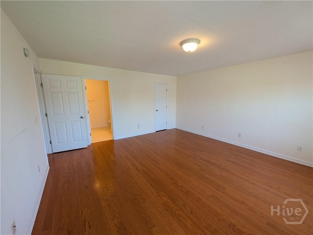 10 Evergreen Oak Dr, Richmond Hill, GA 31324 - empty room with dark wood-style floors and baseboards