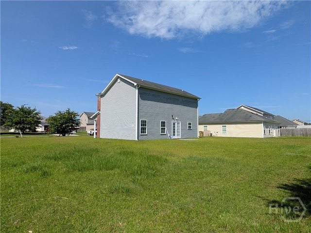 10 Evergreen Oak Dr, Richmond Hill, GA 31324 - back of house featuring a yard