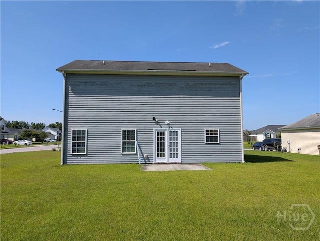 10 Evergreen Oak Dr, Richmond Hill, GA 31324 - back of house with a yard and french doors