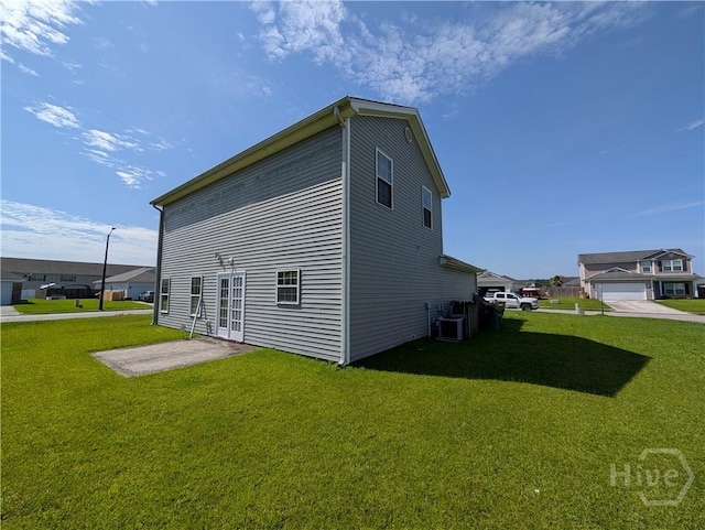10 Evergreen Oak Dr, Richmond Hill, GA 31324 - view of side of home featuring a yard and a cooling unit