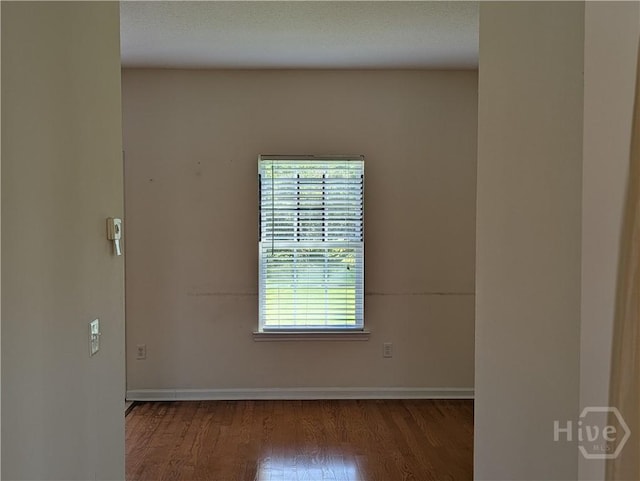10 Evergreen Oak Dr, Richmond Hill, GA 31324 - empty room with wood finished floors and baseboards