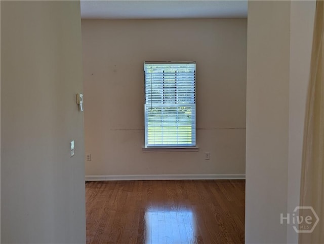 10 Evergreen Oak Dr, Richmond Hill, GA 31324 - empty room with wood finished floors and baseboards
