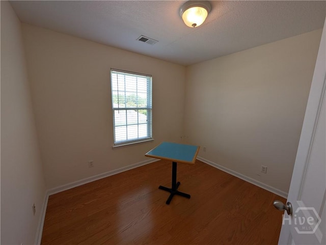 10 Evergreen Oak Dr, Richmond Hill, GA 31324 - spare room with wood finished floors and a textured ceiling