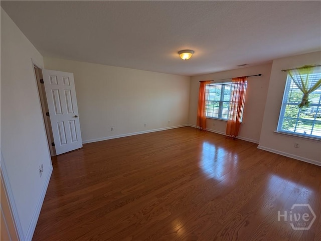 10 Evergreen Oak Dr, Richmond Hill, GA 31324 - empty room featuring wood finished floors and baseboards