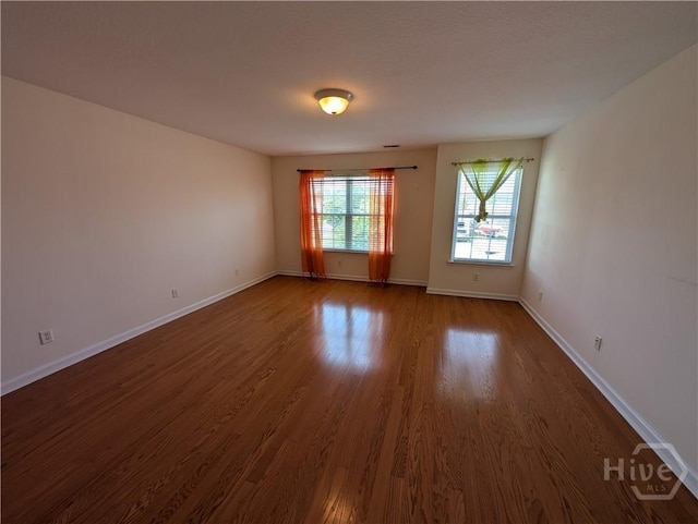 10 Evergreen Oak Dr, Richmond Hill, GA 31324 - unfurnished room featuring dark wood-type flooring and baseboards