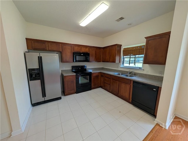 10 Evergreen Oak Dr, Richmond Hill, GA 31324 - kitchen with black appliances and a textured ceiling