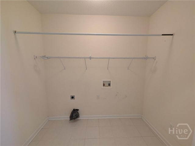 10 Evergreen Oak Dr, Richmond Hill, GA 31324 - laundry area with washer hookup, electric dryer hookup, and light tile patterned flooring