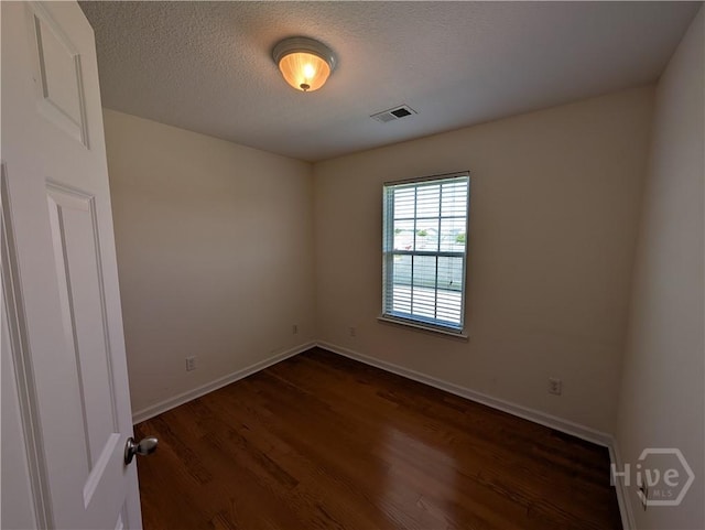 10 Evergreen Oak Dr, Richmond Hill, GA 31324 - spare room with dark wood finished floors and a textured ceiling