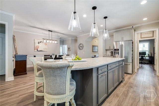 139 Harvest Hl, Pooler, GA 31322 - kitchen with high end refrigerator, gray cabinets, a center island, light wood finished floors, and recessed lighting