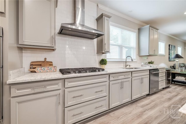 139 Harvest Hl, Pooler, GA 31322 - kitchen featuring wall chimney range hood, appliances with stainless steel finishes, gray cabinets, ornamental molding, and light wood-type flooring