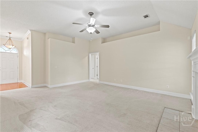 41 Patriot Dr, Richmond Hill, GA 31324 - unfurnished living room with light colored carpet, a ceiling fan, a fireplace, and vaulted ceiling