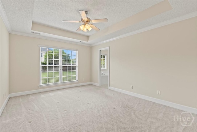 41 Patriot Dr, Richmond Hill, GA 31324 - carpeted spare room featuring a raised ceiling, a textured ceiling, ornamental molding, and a ceiling fan