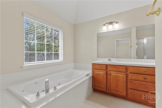 41 Patriot Dr, Richmond Hill, GA 31324 - bathroom featuring vanity, a whirlpool tub, and a stall shower