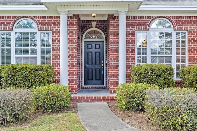 41 Patriot Dr, Richmond Hill, GA 31324 - entrance to property with brick siding and a shingled roof