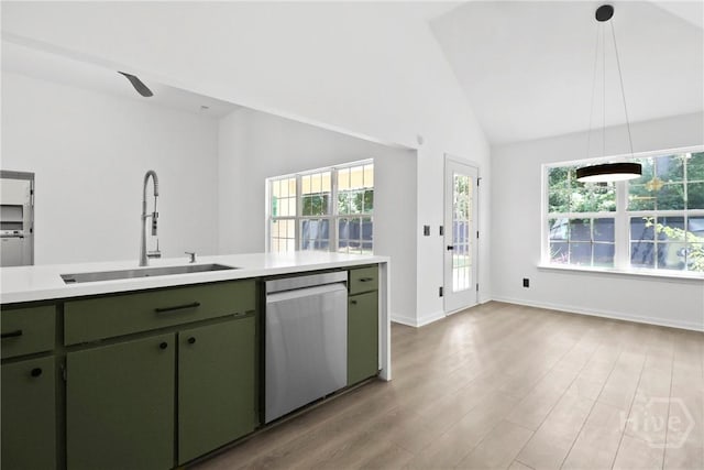 115 Yellow Jasmine Ct, Pooler, GA 31322 - kitchen featuring stainless steel dishwasher, green cabinetry, light countertops, vaulted ceiling, and light wood-style flooring