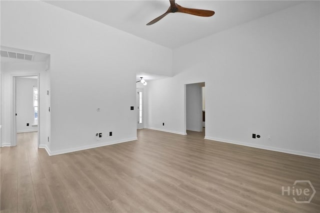 115 Yellow Jasmine Ct, Pooler, GA 31322 - empty room featuring a ceiling fan, light wood finished floors, and a high ceiling