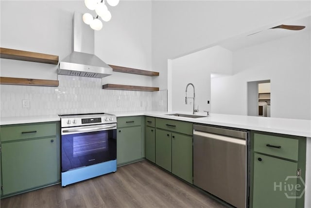 115 Yellow Jasmine Ct, Pooler, GA 31322 - kitchen with open shelves, stainless steel appliances, wall chimney range hood, and green cabinets