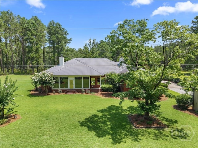 2055 Blankenbaker Rd, Statesboro, GA 30458 - view of front of property featuring a chimney, a front yard, and a metal roof