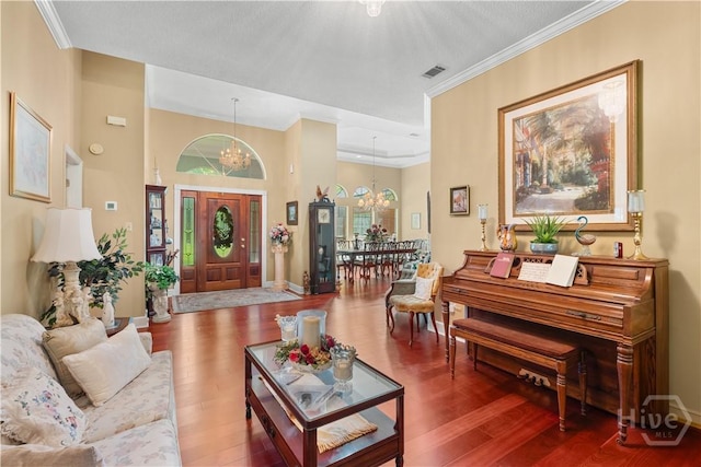 2055 Blankenbaker Rd, Statesboro, GA 30458 - living room with a chandelier, wood finished floors, and crown molding