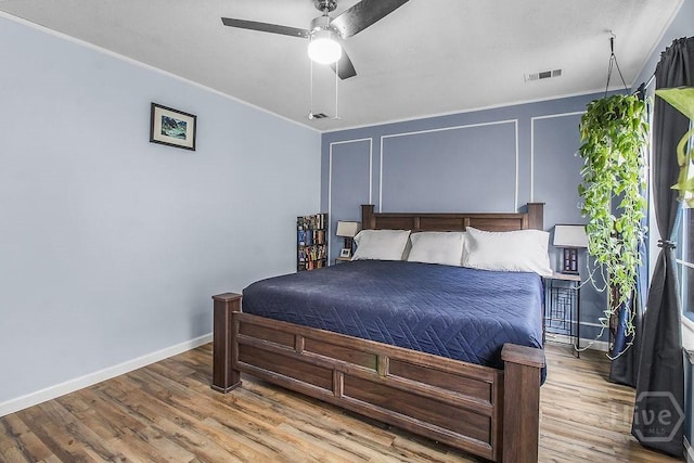 250 Laurel Hill Cir, Richmond Hill, GA 31324 - bedroom with ornamental molding, wood finished floors, and ceiling fan