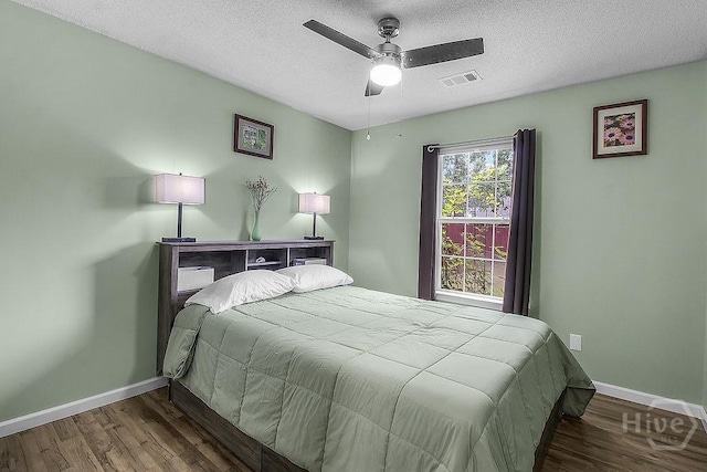 250 Laurel Hill Cir, Richmond Hill, GA 31324 - bedroom with wood finished floors, a textured ceiling, and ceiling fan