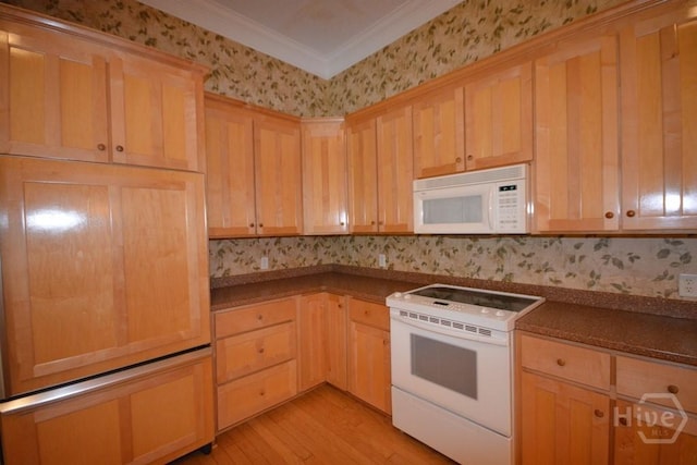 2 Jasmine Xing, Savannah, GA 31405 - kitchen featuring white appliances, dark countertops, wallpapered walls, light wood-type flooring, and light brown cabinetry