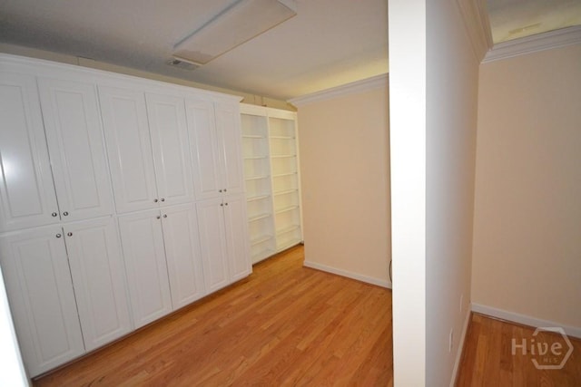 2 Jasmine Xing, Savannah, GA 31405 - unfurnished bedroom featuring crown molding, light wood-style floors, and a closet
