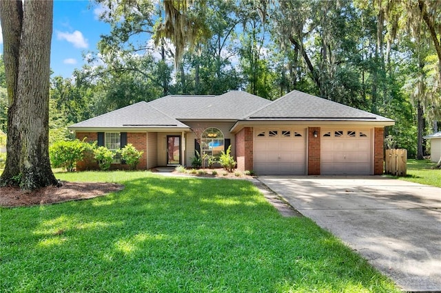 716 Greenwich Dr, Richmond Hill, GA 31324 - single story home featuring a garage, brick siding, concrete driveway, a front lawn, and roof with shingles