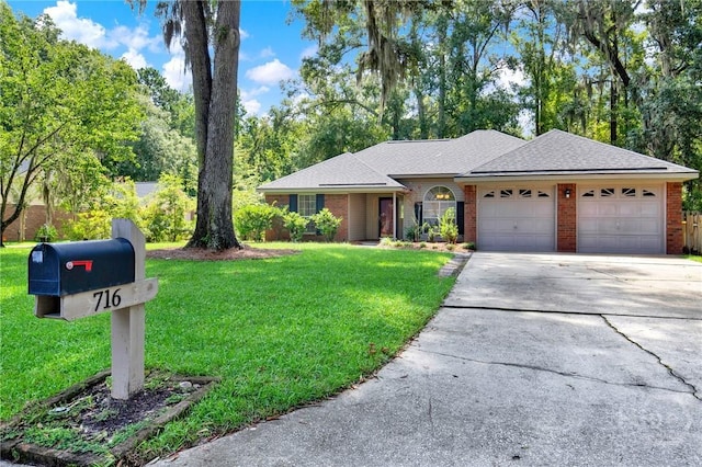 716 Greenwich Dr, Richmond Hill, GA 31324 - ranch-style home with driveway, an attached garage, brick siding, a front yard, and a shingled roof
