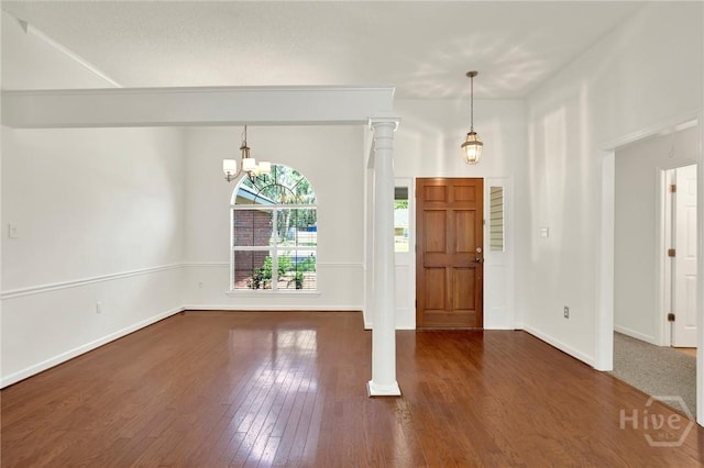 716 Greenwich Dr, Richmond Hill, GA 31324 - entrance foyer with dark wood-style floors and a chandelier
