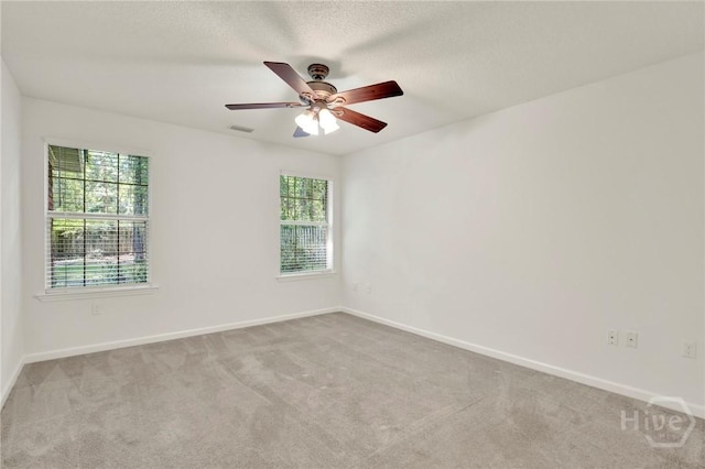 716 Greenwich Dr, Richmond Hill, GA 31324 - unfurnished room featuring healthy amount of natural light, carpet floors, and ceiling fan