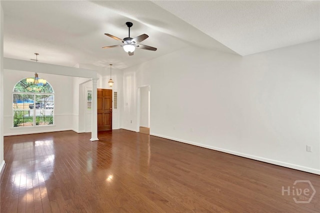 716 Greenwich Dr, Richmond Hill, GA 31324 - unfurnished living room with dark wood-style flooring, ceiling fan, and lofted ceiling
