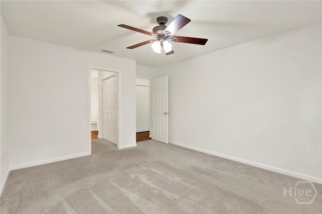716 Greenwich Dr, Richmond Hill, GA 31324 - unfurnished bedroom with carpet flooring and a ceiling fan
