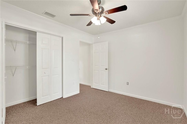 716 Greenwich Dr, Richmond Hill, GA 31324 - unfurnished bedroom featuring carpet, a closet, ornamental molding, and ceiling fan