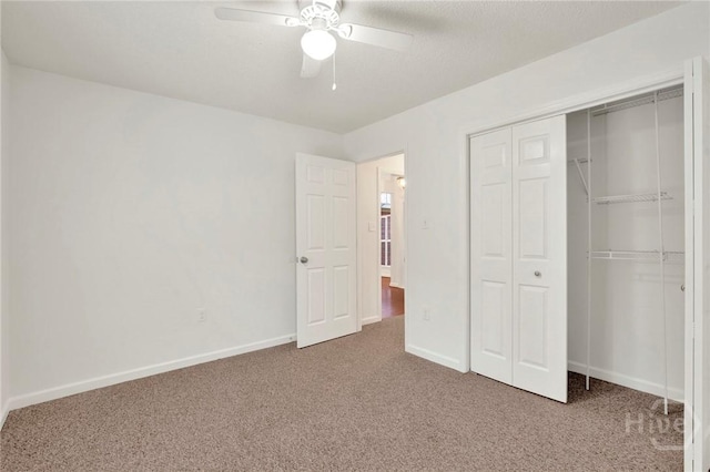 716 Greenwich Dr, Richmond Hill, GA 31324 - unfurnished bedroom with carpet, a closet, and a ceiling fan