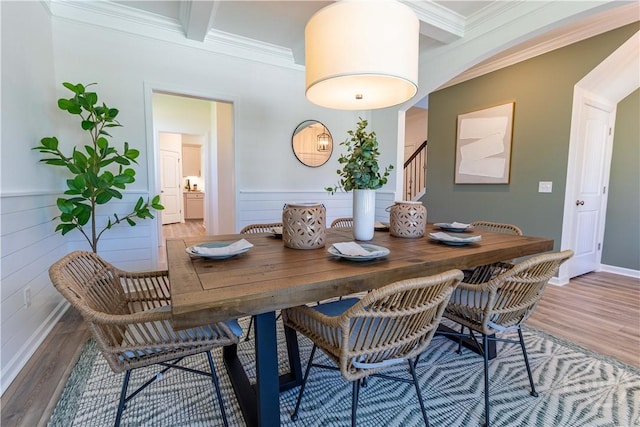 33 Spring Hill Dr, Richmond Hill, GA 31324 - dining area featuring crown molding, light wood-style floors, stairway, and beamed ceiling