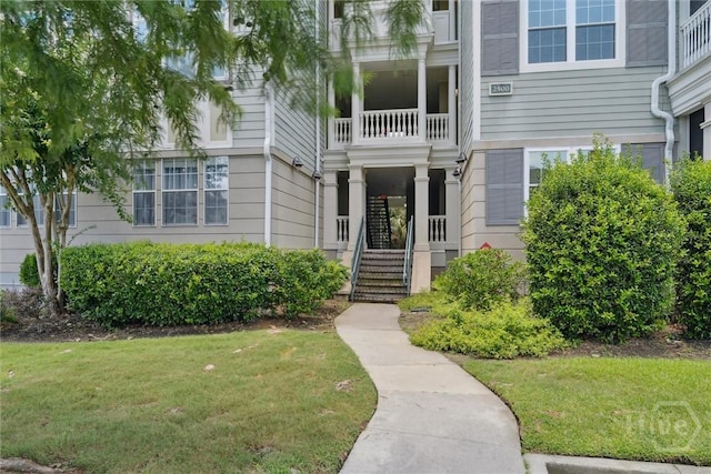 2536 Whitemarsh Way, Savannah, GA 31410 - property entrance featuring a lawn and a balcony