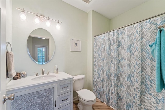 2536 Whitemarsh Way, Savannah, GA 31410 - full bathroom with vanity, wood finished floors, and a shower with curtain