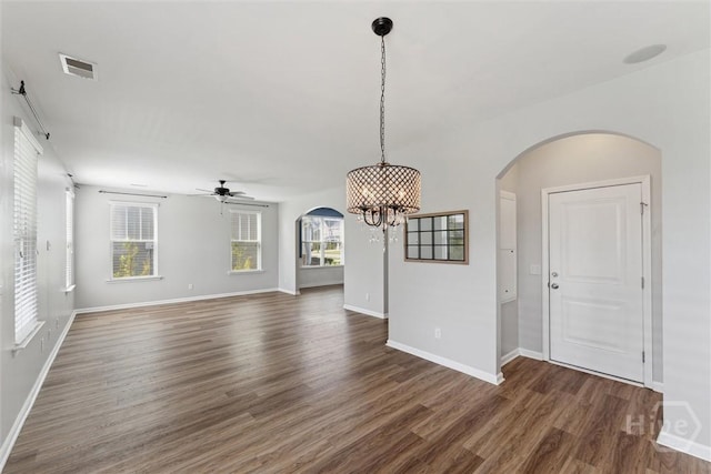 54 Winslow, Savannah, GA 31407 - unfurnished living room with arched walkways, a chandelier, wood finished floors, and ceiling fan