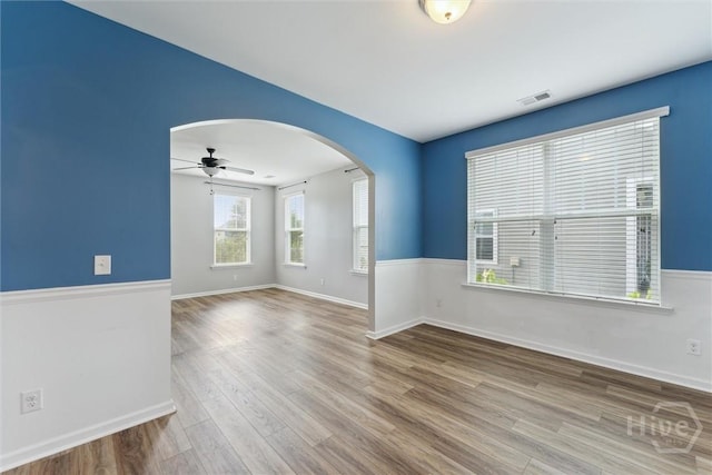 54 Winslow, Savannah, GA 31407 - spare room featuring arched walkways, wood finished floors, and ceiling fan