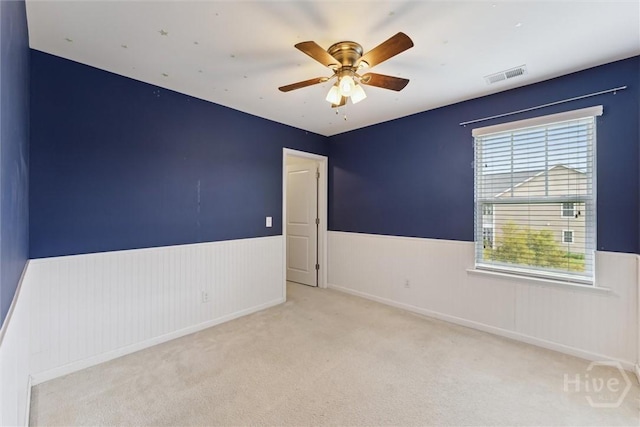 54 Winslow, Savannah, GA 31407 - carpeted spare room featuring a wainscoted wall and a ceiling fan